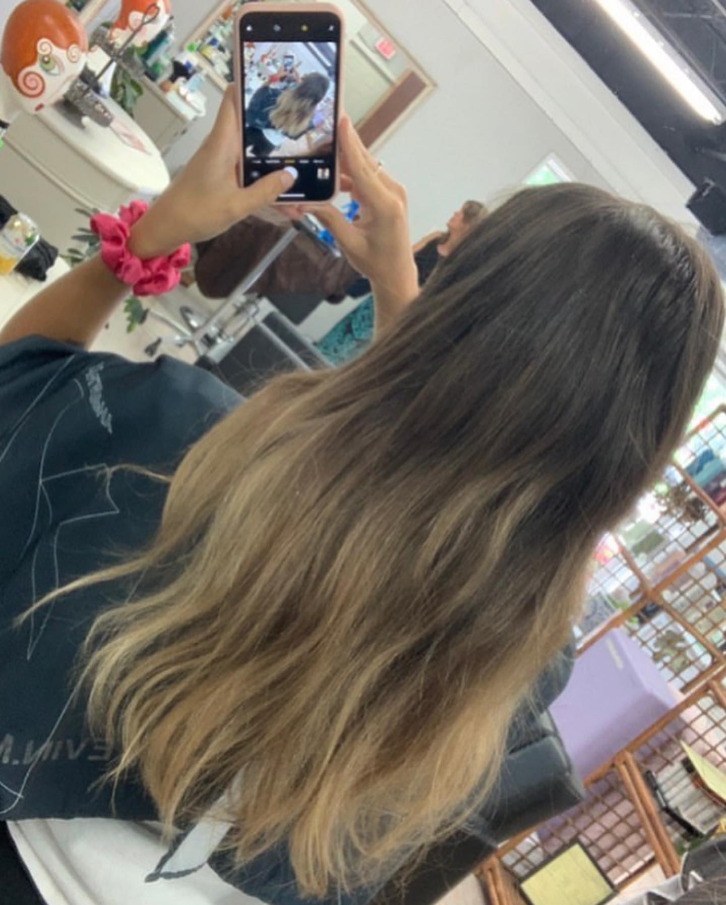 A finished ombre color being photographed in the salon