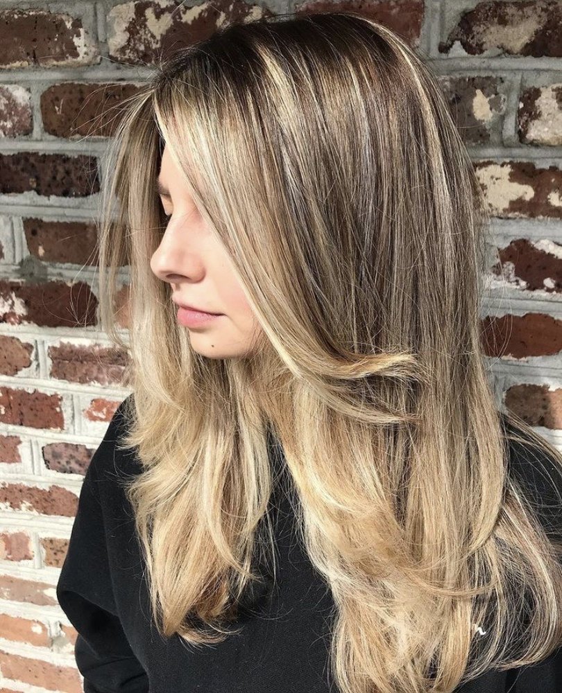 Long blonde layers seen from the side