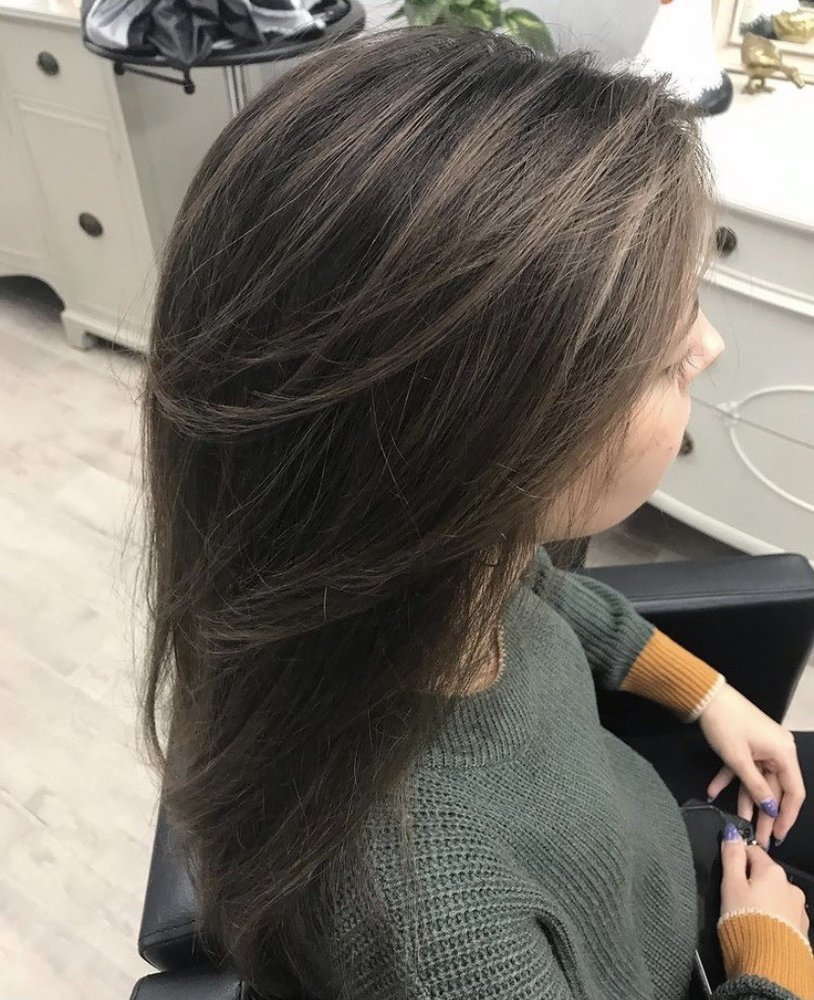 Dark layered cut with subtle highlights